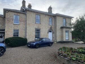 LandVac Vacuum Glass Georgian Sliding Sash Windows in sand coloured brick Georgian country house